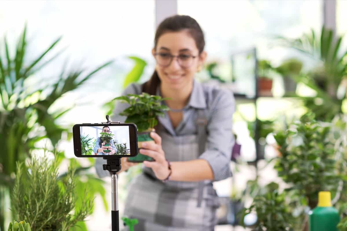 Gardener vlogger recording videos at home
