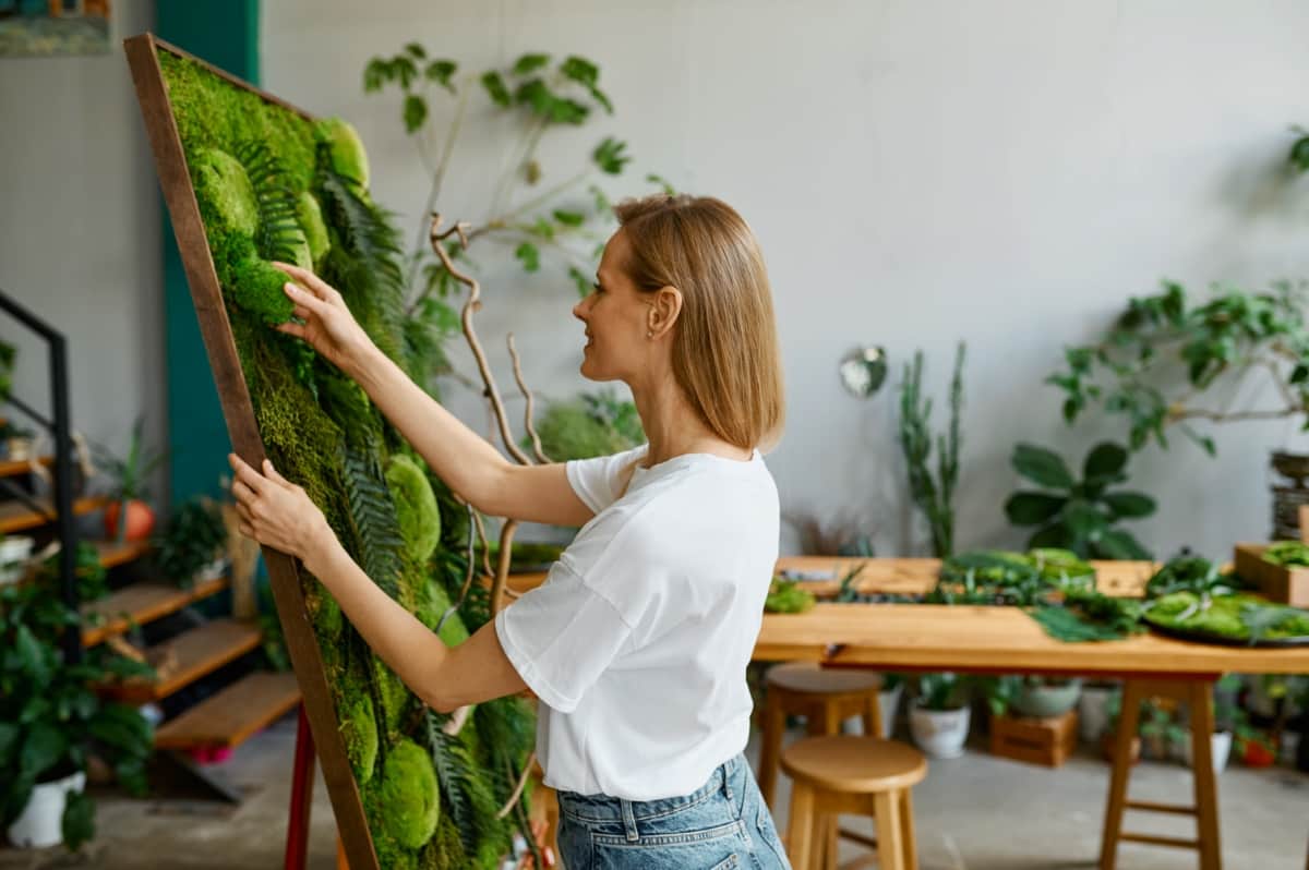 Florist Decorator Creating Plant Moss Panel