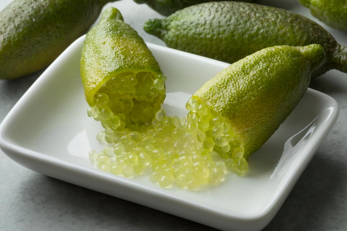 Halved Fresh Raw Green Finger Lime Caviar